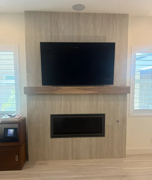 Fluted stone fireplace wall